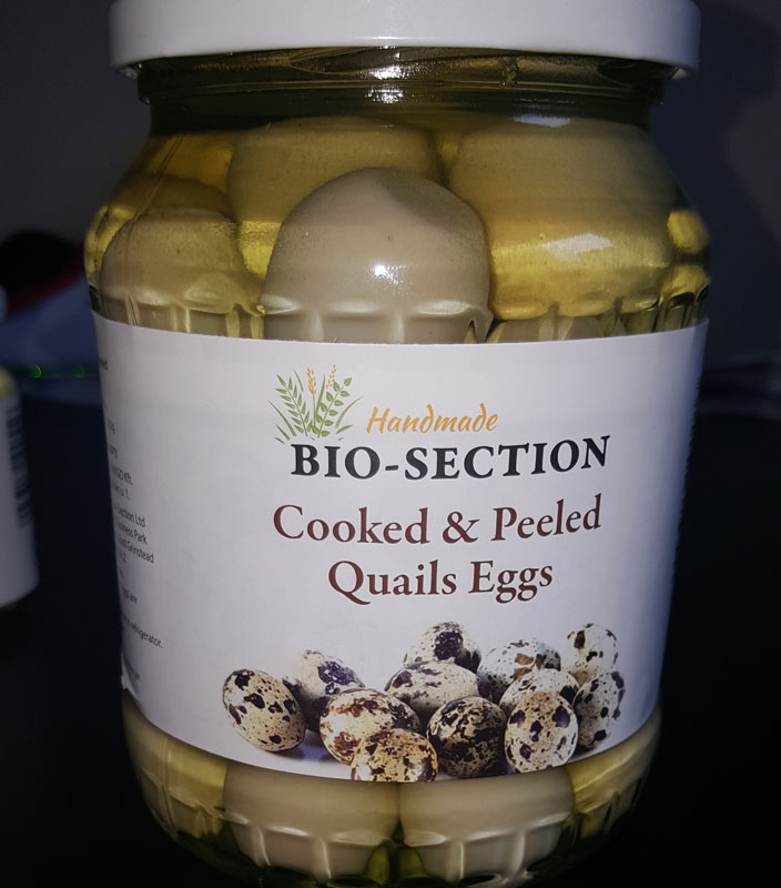 Hard Boiled an peeled in big jar quail eggs